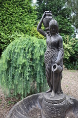 Statue of a lady holding jugs