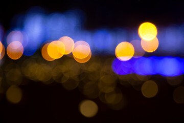 Colored blurred bokeh. abstract background of included festive garlands. colorful blur light bulbs