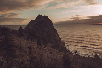 Moody winter scene with Oregon Coast Sea Stack at dusk