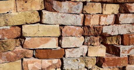 Weathered painted old brick wall background. Brickwork paint.