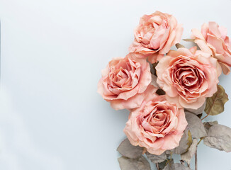 Flowers composition. Bouquet of pink roses in pastel colors. Flatlay.