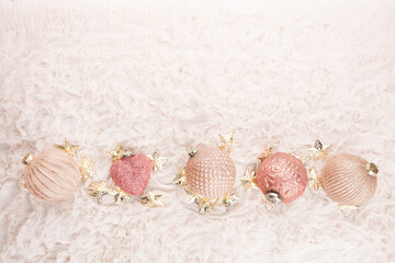 Golden christmas balls with wool background.
