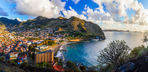Breathtaking scenery of Madeira island, View of Machico town and beautiful bay with sandy beach. Eastern part of the island. Portugal travel - obrazy, fototapety, plakaty