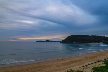 One hundred percent cloud covered sunrise over the sea