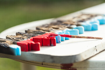 Brush on a polystyrene surface on a table outdoors
