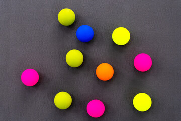 Fototapeta na wymiar Colored Myofascial release massage balls on gray mat. View on top