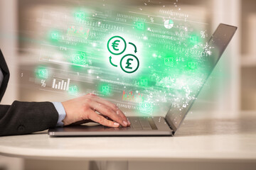 Young man watching stock market on laptop