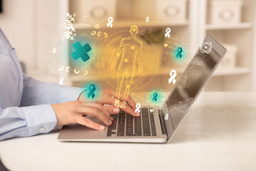 Doctor working on laptop with healthcare concept