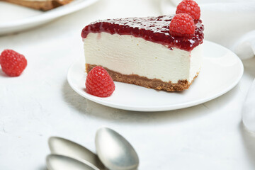 delicious portion of strawberry and raspberry cheesecake