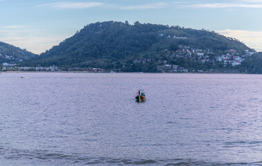 Naklejka premium Panoramic View of Patong Beach with the vibrant multi colours of the sunset Phuket Thailand 