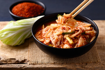 Korean kimchi cabbage in a bowl eating by chopsticks, Asian fermented food, Still Life