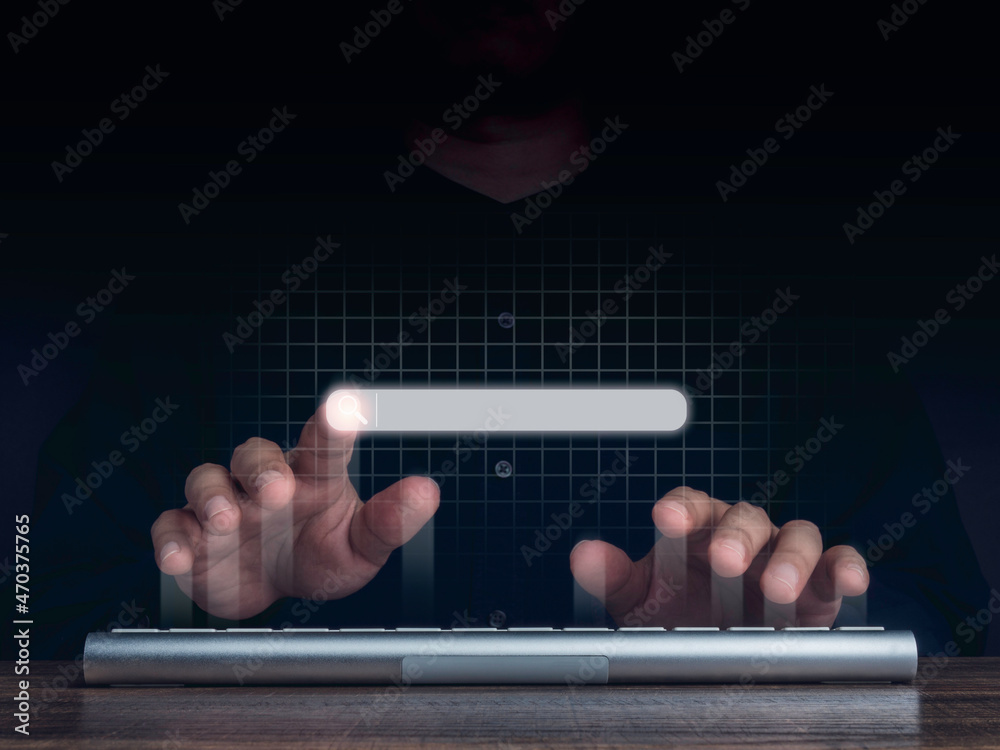Aufkleber searching icon on search engine bar pointing by man's finger while using computer keyboard with netw