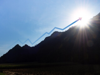 The rising up arrow on the mountain with sunlight from behind. Leadership and success Concept. The...