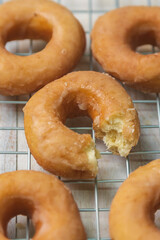 Delicious donuts on iron griddle covered with cloth