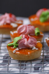 Delicious cup cakes on a griddle covered with cloth.