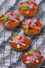 Delicious cup cakes on a griddle covered with cloth.