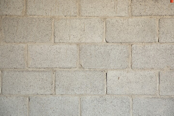 background of block wall or gray concrete bricks glued with cement