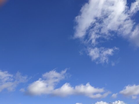 Autumn sky, white clouds in blue sky, background