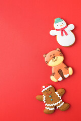 Set of traditional Christmas gingerbread on bright red background party banner. Copy space.