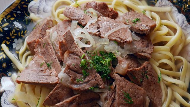 Etnic Kazakh food - beshbarmak, meat with noodles