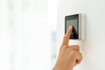 smart house, device with app icons. Man uses his smartphone security app to unlock the door of his...