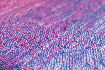Fototapeta premium Multicolored texture textile in a wooden loom machine.