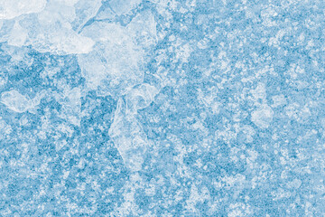Ice texture background. Crushed ice blue-toned pattern.