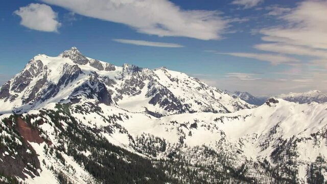 Aerial Pan of Cascade Mountain Range and Mt Shuksan with Spring Snow