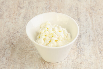 Grained cottage cheese in the bowl