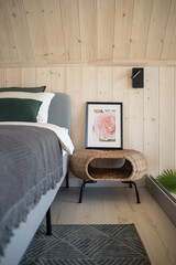 Barnhouse, Barn house. Wooden secluded house in the Scandinavian and Finland modern style with large windows. Bedroom interior, wooden walls.