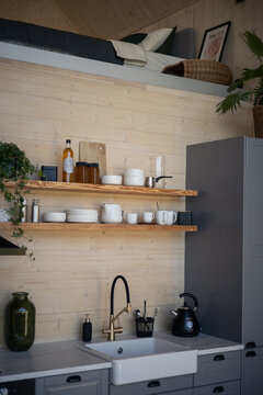 Barnhouse, Barn house kitchen interior. Wooden secluded house in the Scandinavian and Finland modern style with large windows. Kitchen shelves and dishes