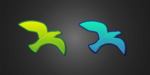 Green and blue Bird seagull icon isolated on black background. Vector