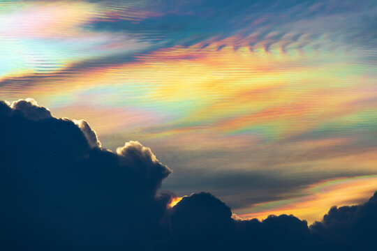 Beautiful iridescent cloud, Irisation. Skyscraper background.