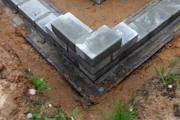 Bricklaying of foundation blocks for a new home. House construction concept