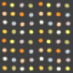 Bright colored confetti on a dark background. Seamless abstract pattern. Christmas lights with blur effect. For textiles and gift wrapping paper.