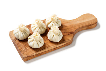 Homemade raw dumpling with chicken meat. Preparation chinese dumplings with meat and greens . isolated on white background