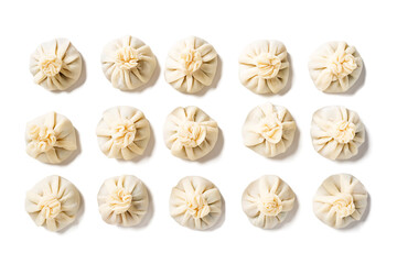 Homemade raw dumpling with chicken meat. Preparation chinese dumplings with meat and greens . isolated on white background. top view