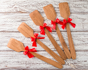 wooden kitchen spatulas with a red bow