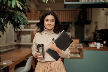 Young freelancer ready to work in cafe