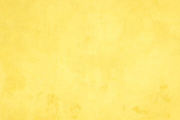 Concrete wall yellow color for texture background. Abstract grunge bright colorful color background with growing effect. Pastel yellow colored low contrast textured with roughness and irregularities.