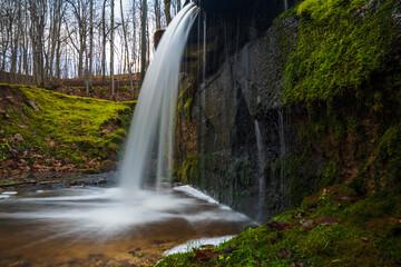 Waterfall. A wall covered with moss.