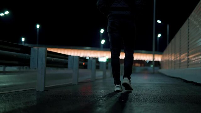 Russia,Yamalo-Nenets Autonomous Okrug, Novy Urengoy city, October 17, 2021, 22:00, a 35-year-old guy smokes a cigarette in the courtyard of a house in the Vostochny microdistrict at his white car