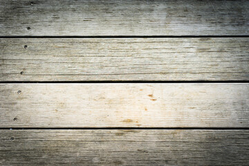 Wooden planks placed horizontally with lots of texture and light tones. Background concept.