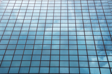 sky and glass facade of the building