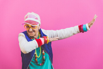 Funny grandmother portraits. 80s style outfit. Dab dance on colored backgrounds. Concept about...