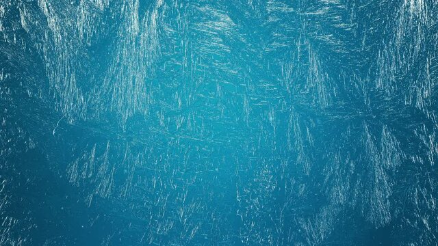 Frozen window with frosty patterns gradually fills with frost over its entire surface. It is snowing in the background. Great background for Christmas and New Years. 