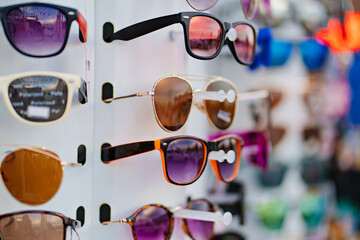 counter with sunglasses. sale of goods for tourists 