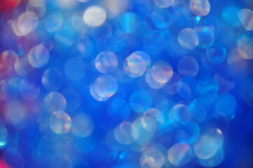 Abstract circles made of light in the night.Blue bokeh abstract background.Abstract blurred colorful circles on blue background.Element of design.Blurred, bokeh blue lights background. Abstract sparkl