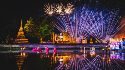 Fototapeta na wymiar Firework at event of Loi Krathong festival showing in Sukhothai historical park, Thailand.