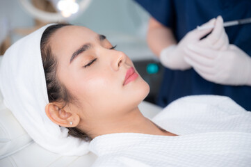 Obraz na płótnie Canvas young Asian woman making cosmetology treatment skin injection, Mesotherapy of face beauty care